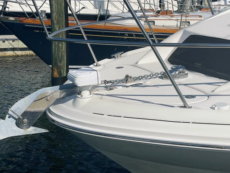 Slide: The Image of Bow of a white boat with anchor and chain in the water. - 5