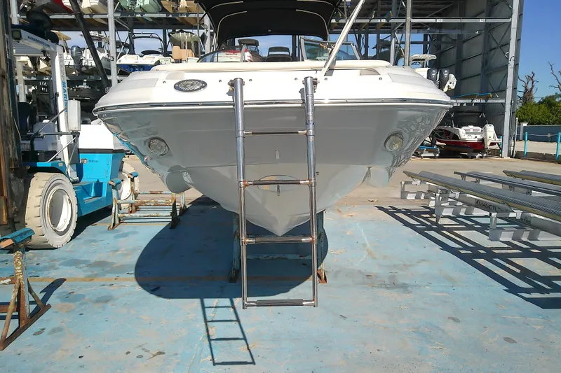 Slide: The Image of 2017 Crownline Eclipse E6 XS boat on dry dock with ladder access. - 11