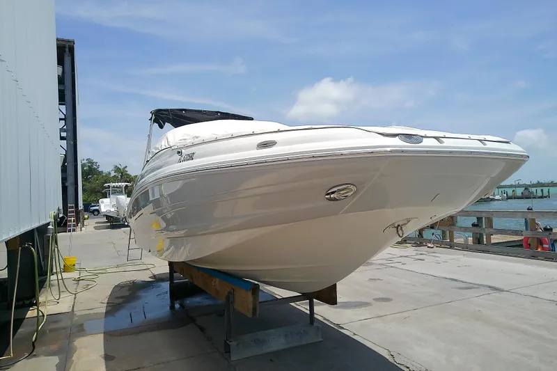 Slide: The Image of 2017 Crownline Eclipse E6 XS boat on dock, sunny day, marina background. - 14