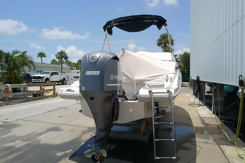 Slide: The Image of 2017 Crownline Eclipse E6 XS boat with Yamaha 300 outboard motor, docked outdoors. - 18