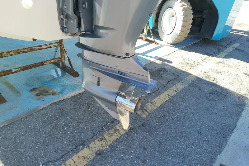 Slide: The Image of 2017 Crownline Eclipse E6 XS boat propeller and outboard motor on a sunny day. - 19