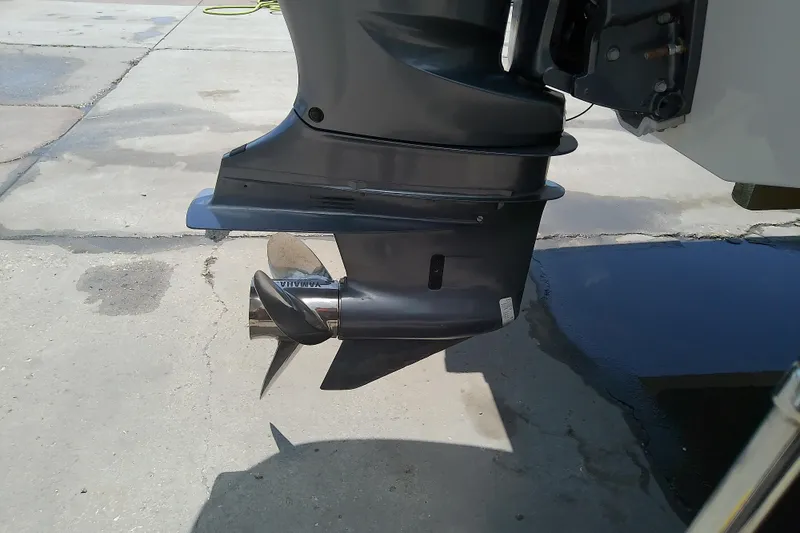 Slide: The Image of 2017 Crownline Eclipse E6 XS boat motor with Yamaha propeller on concrete surface. - 20