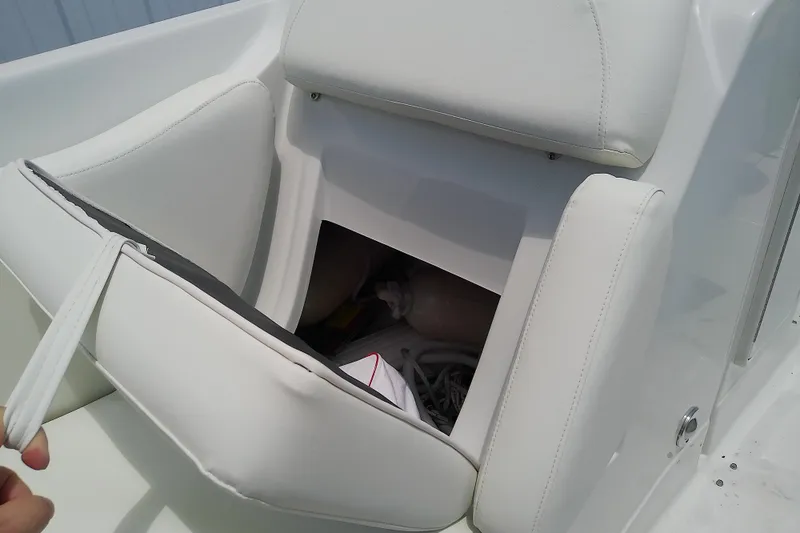 Slide: The Image of 2017 Crownline Eclipse E6 XS boat seat storage compartment open. - 33