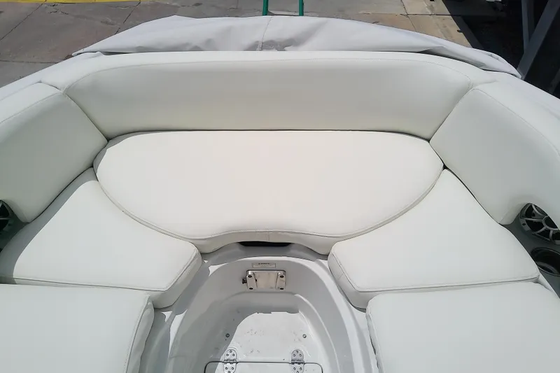 Slide: The Image of 2017 Crownline Eclipse E6 XS boat with white cushioned seating area. - 34