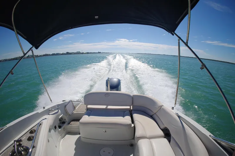 Slide: The Image of 2017 Crownline Eclipse E6 XS cruising on clear blue waters under a sunny sky. - 35