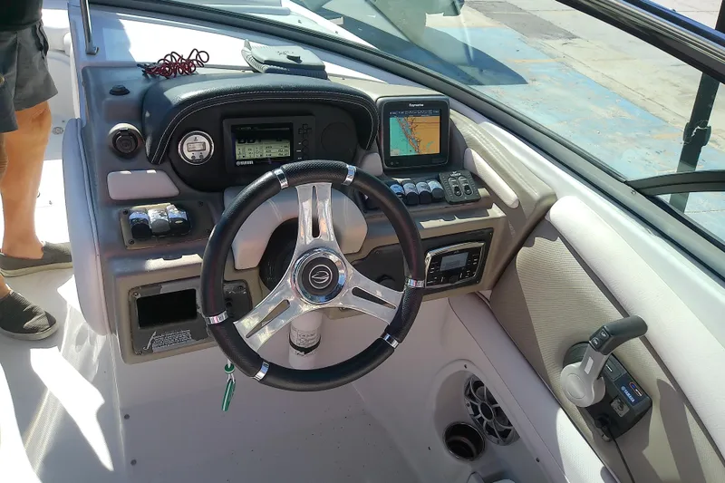 Slide: The Image of 2017 Crownline Eclipse E6 XS boat dashboard with steering wheel and navigation controls. - 46