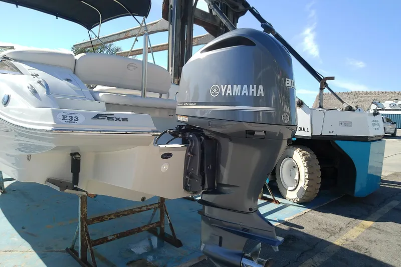 Slide: The Image of 2017 Crownline Eclipse E6 XS boat with Yamaha outboard motor in a marina setting. - 5