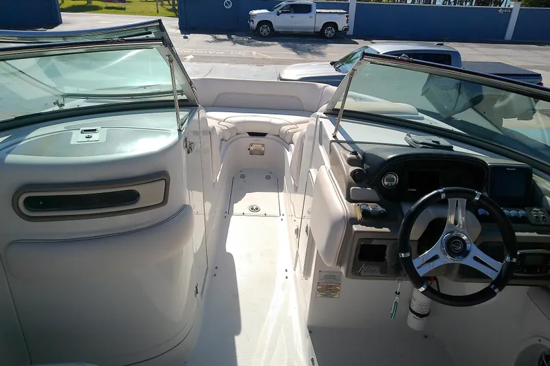 Slide: The Image of 2017 Crownline Eclipse E6 XS boat interior with steering wheel and seating area. - 53