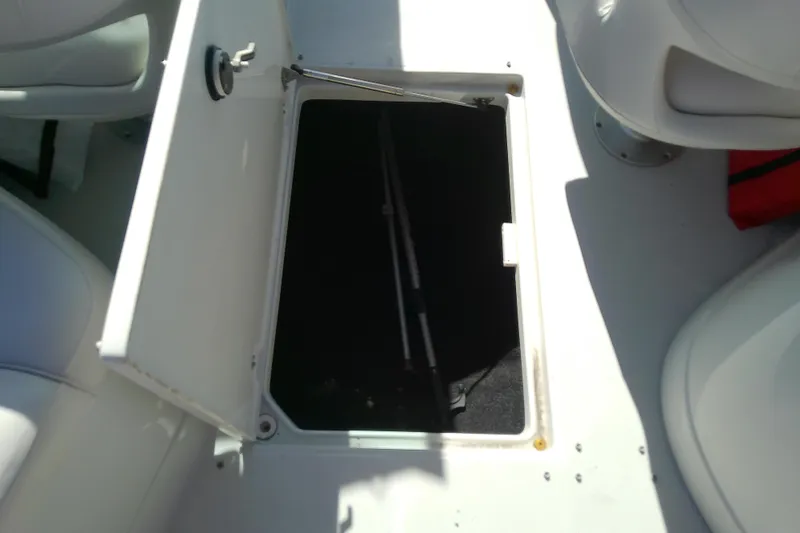 Slide: The Image of Open storage compartment on a 2017 Crownline Eclipse E6 XS boat. - 56