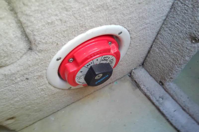 Slide: The Image of Red battery switch on 2017 Crownline Eclipse E6 XS boat interior. - 59