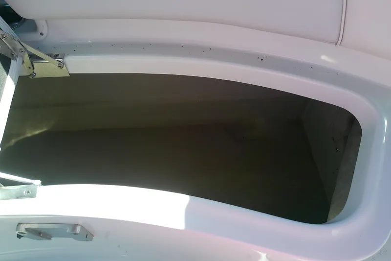 Slide: The Image of Storage compartment of a 2017 Crownline Eclipse E6 XS boat, open and empty. - 60