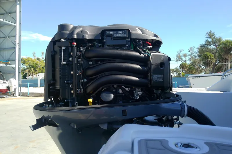 Slide: The Image of 2017 Crownline Eclipse E6 XS outboard engine, detailed view in a marina setting. - 65