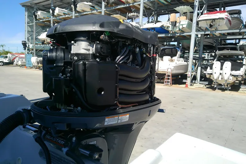 Slide: The Image of 2017 Crownline Eclipse E6 XS outboard motor in a boat storage facility. - 66