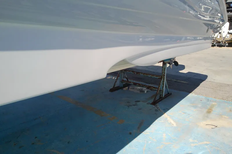 Slide: The Image of 2017 Crownline Eclipse E6 XS boat hull on a stand, outdoor setting. - 9