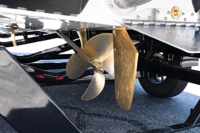 Slide: The Image of Close-up of 2026 Tigé Ultré 23ZX boat propeller and rudder on a trailer. - 14