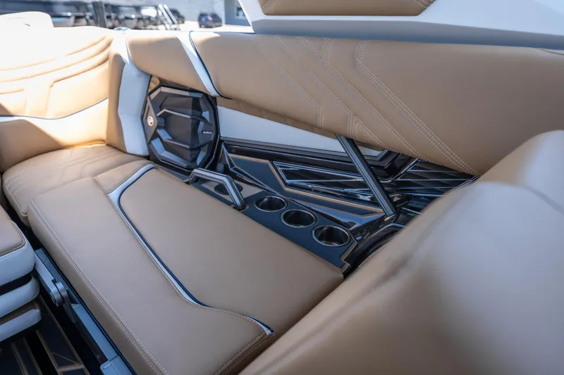 Slide: The Image of Luxurious interior of 2026 Tigé Ultré 23ZX boat with tan seating and cup holders. - 16