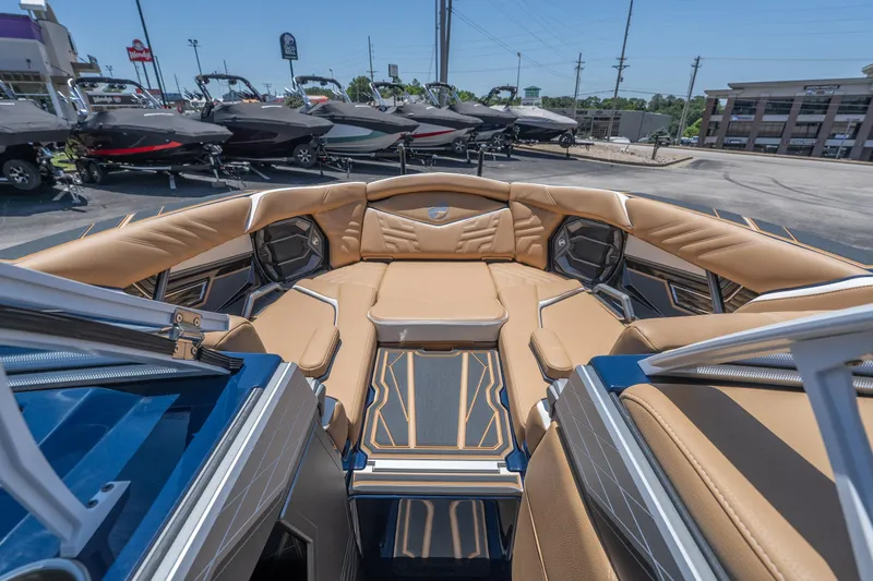 Slide: The Image of 2026 Tigé Ultré 23ZX boat interior with luxurious tan seating and modern design. - 19