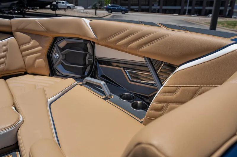 Slide: The Image of Luxurious interior of 2026 Tigé Ultré 23ZX boat with tan leather seating and cup holders. - 20