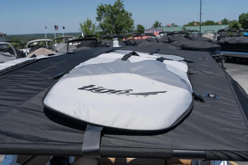 Slide: The Image of 2026 Tigé Ultré 23ZX boat cover on display, showcasing sleek design and branding. - 23