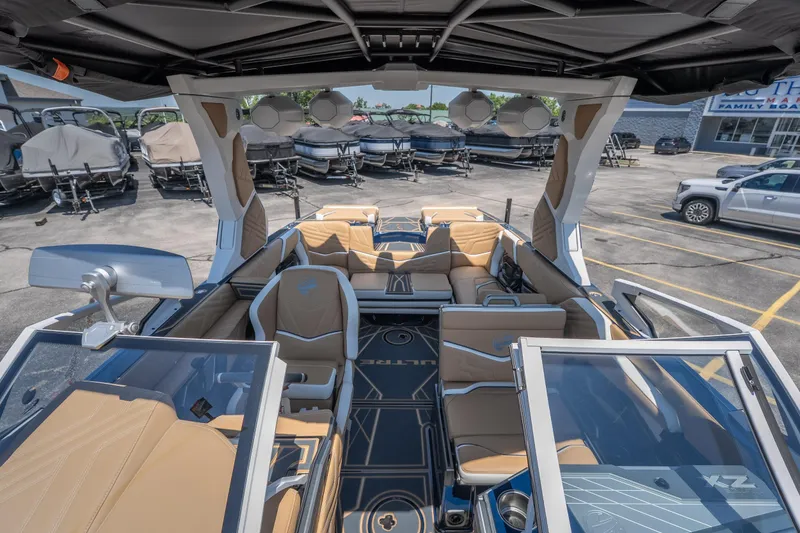 Slide: The Image of Interior of 2026 Tigé Ultré 23ZX boat with luxurious seating and modern design. - 24