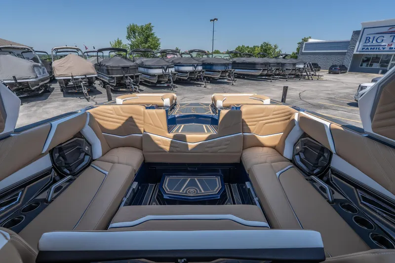 Slide: The Image of Luxurious interior of 2026 Tigé Ultré 23ZX boat with tan seating and modern design. - 25
