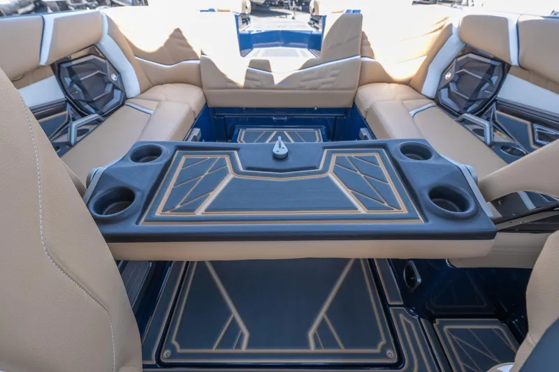 Slide: The Image of Interior of 2026 Tigé Ultré 23ZX boat with stylish seating and table design. - 26