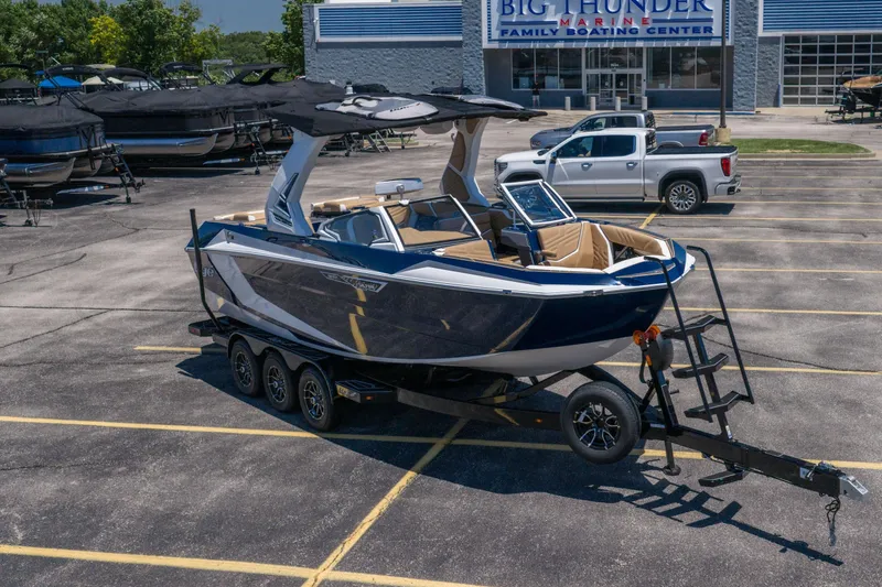 Slide: The Image of 2026 Tigé Ultré 23ZX boat on trailer at Big Thunder Marine dealership. - 37