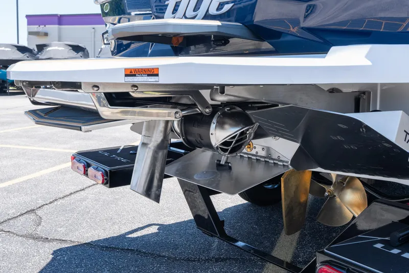 Slide: The Image of Rear view of 2026 Tigé Ultré 23ZX boat showcasing propeller and hull design. - 5