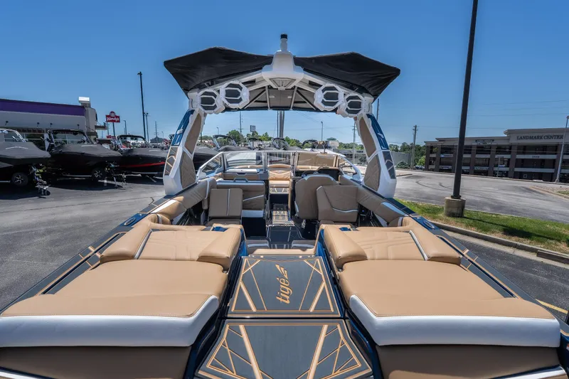 Slide: The Image of 2026 Tigé Ultré 23ZX boat with luxurious seating and modern design in a parking lot. - 6