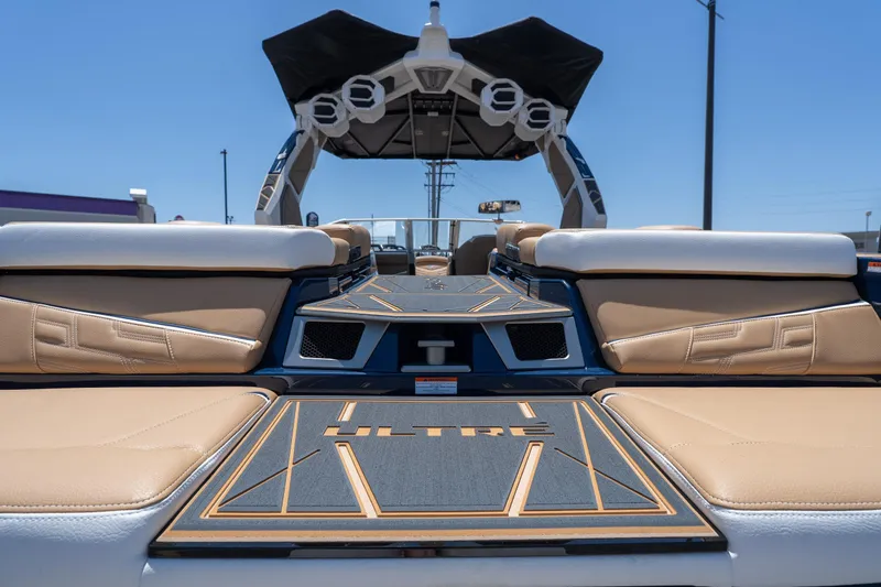 Slide: The Image of 2026 Tigé Ultré 23ZX boat interior with tan seating and sleek design. - 7