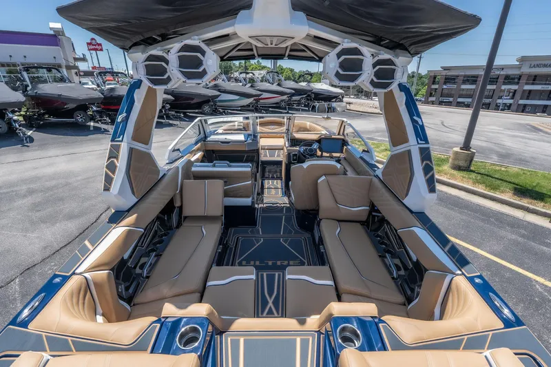 Slide: The Image of 2026 Tigé Ultré 23ZX boat interior with luxurious seating and advanced audio system. - 8