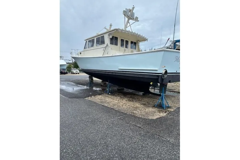 Slide: The Image of Large boat on stands in a marina, overcast sky, Flowers 43 model, 2016. - 1