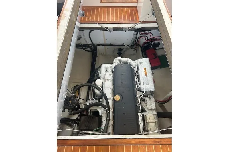 Slide: The Image of Engine compartment of a 2016 Flowers 43 boat, showcasing detailed mechanical components. - 18