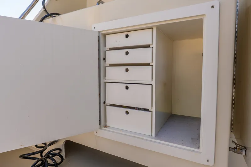 Slide: The Image of Open white cabinet with multiple small drawers, Flowers model 43, 2016. - 13
