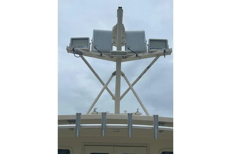 Slide: The Image of Boat radar and communication equipment on a Flowers 43, 2016 model, under cloudy sky. - 29