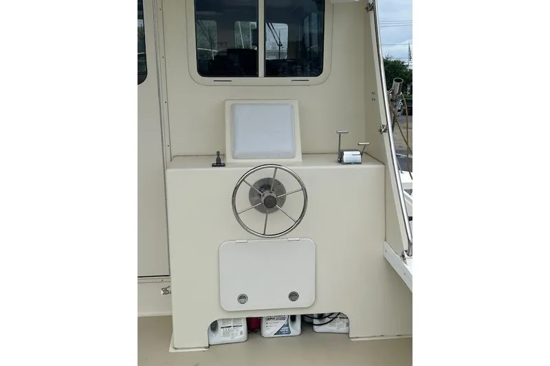 Slide: The Image of Boat steering console with wheel, storage compartment, and window, Flowers model 43, 2016. - 6