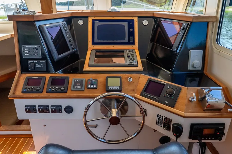 Slide: The Image of Boat cockpit with navigation instruments and steering wheel, Flowers model 43, 2016. - 25