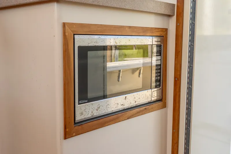 Slide: The Image of Built-in Panasonic microwave with wooden frame, model 43, year 2016. - 31