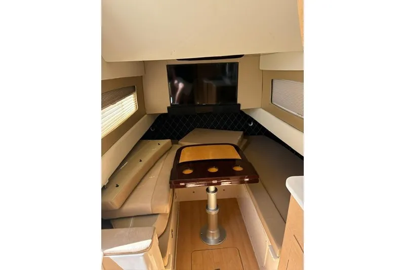 Slide: The Image of Interior of 2018 Scout 420 LXF boat with seating and table setup. - 17