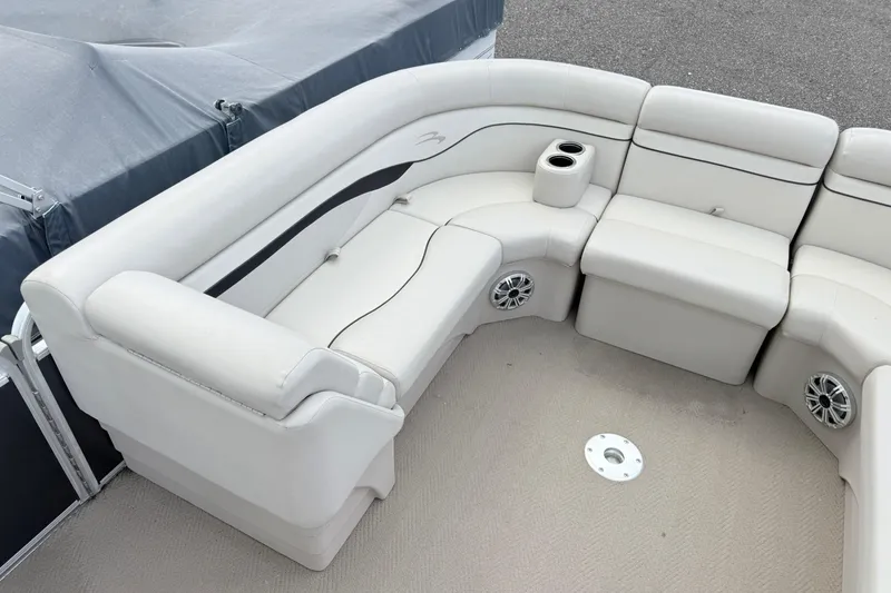 Slide: The Image of Luxurious seating on a 2015 Bennington 24SSLX pontoon boat with cup holders and speakers. - 5