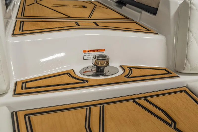 Slide: The Image of 2026 Tigé Z3 boat deck with teak-style flooring and a metal cleat. - 11