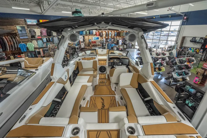 Slide: The Image of 2026 Tigé Z3 boat interior in a showroom, featuring luxurious seating and modern design. - 12