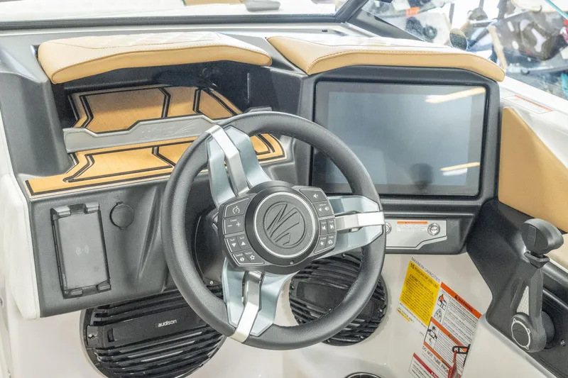 Slide: The Image of 2026 Tigé Z3 boat dashboard with modern steering wheel and touchscreen display. - 18