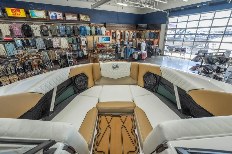 Slide: The Image of Interior of 2026 Tigé Z3 boat in a showroom with apparel displays. - 19