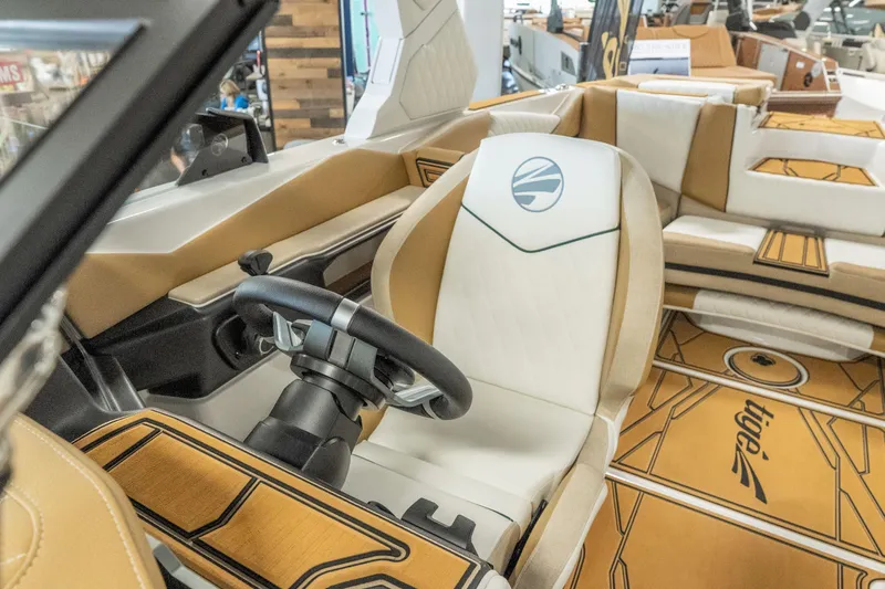 Slide: The Image of 2026 Tigé Z3 boat interior with tan and white seating, modern steering wheel. - 25