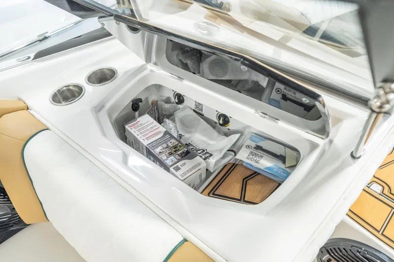 Slide: The Image of Storage compartment in 2026 Tigé Z3 boat with manuals and accessories. - 26