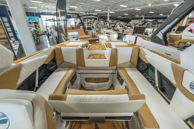 Slide: The Image of 2026 Tigé Z3 boat interior with luxurious seating and modern design in showroom. - 27