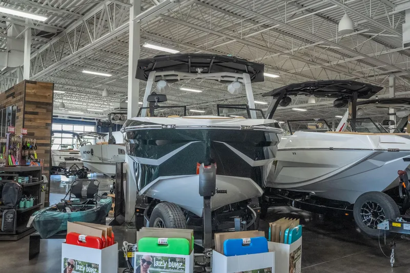 Slide: The Image of 2026 Tigé Z3 boat displayed in a showroom with accessories and equipment. - 3