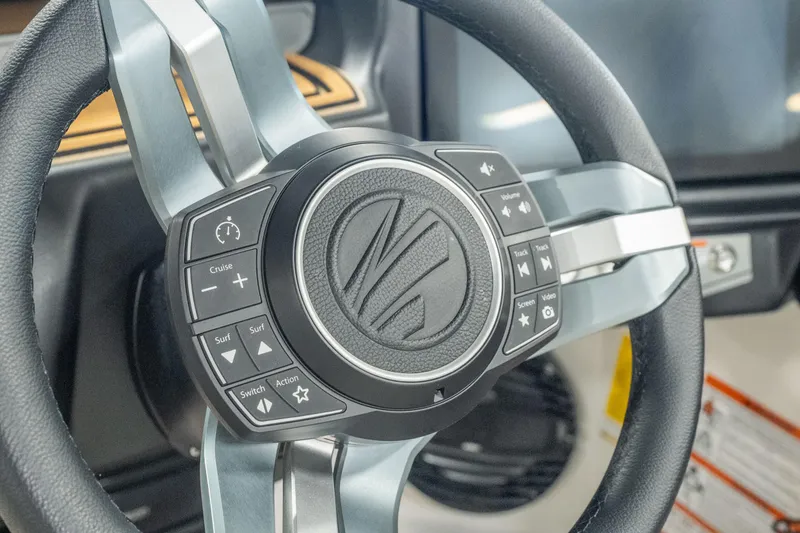 Slide: The Image of Steering wheel of 2026 Tigé Z3 boat with integrated control buttons. - 30
