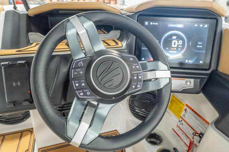 Slide: The Image of Steering wheel and dashboard of 2026 Tigé Z3 boat with advanced controls and display. - 34